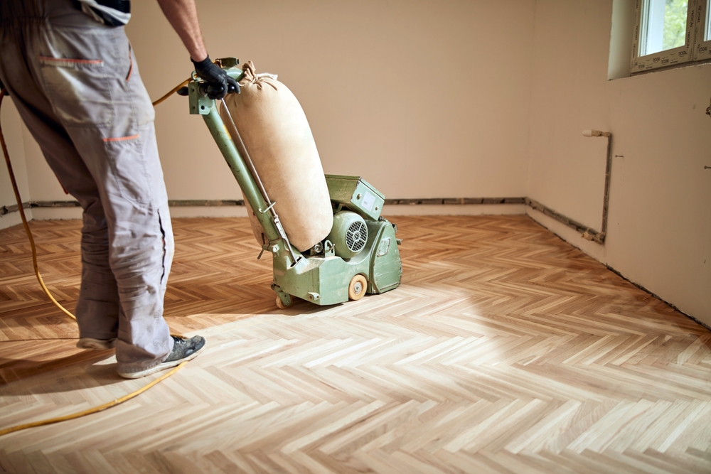 Floor sanding machine on a parquet floor